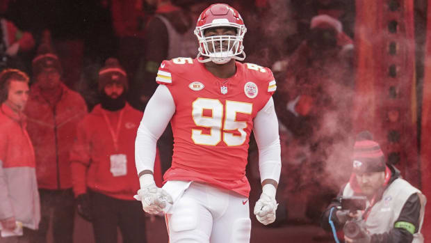 Chris Jones runs out of a tunnel with both hands down by his side